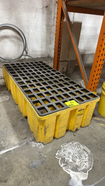 Eagle 1620 secondary spill containment pallet. Features yellow polyethylene construction, removable black poly grating, and a bottom drain plug. 52"L