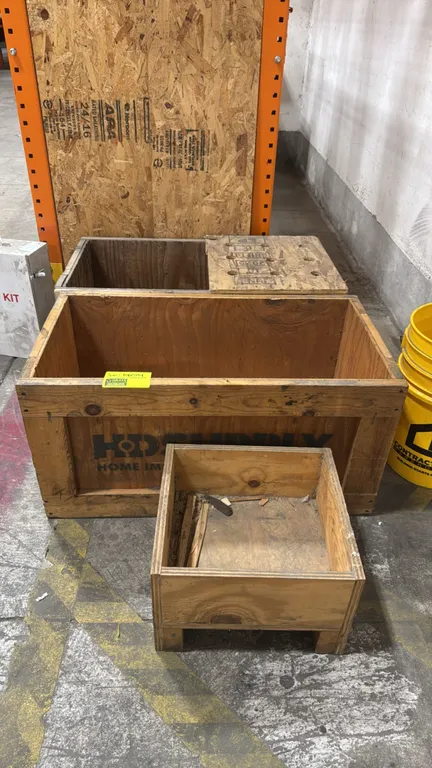 Wood crates. Features plywood and dimensional lumber construction. Includes 16" and 34" crates. Open-top design with one crate raised on block feet. S