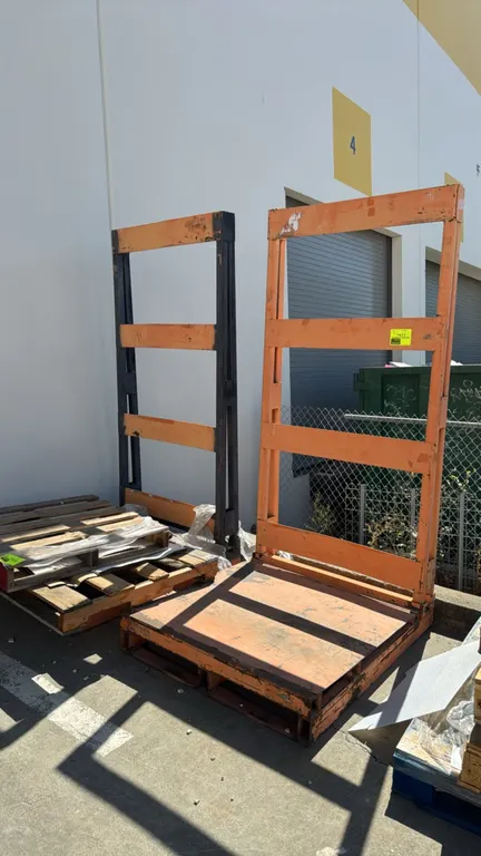 Metal storage racks. Features steel construction, integrated forklift pockets, solid steel platform deck, and vertical backstop frames. Dimensions: 40