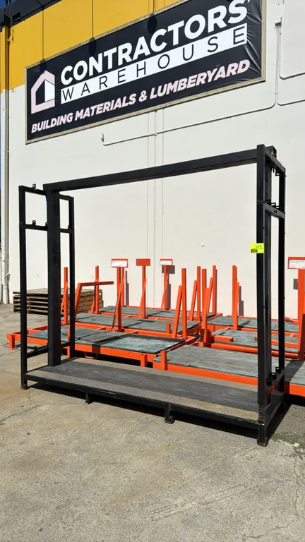 Metal rack. Features tubular steel frame construction, integrated wood uprights with upper header beam, and a solid lower platform deck. Dimensions: 1