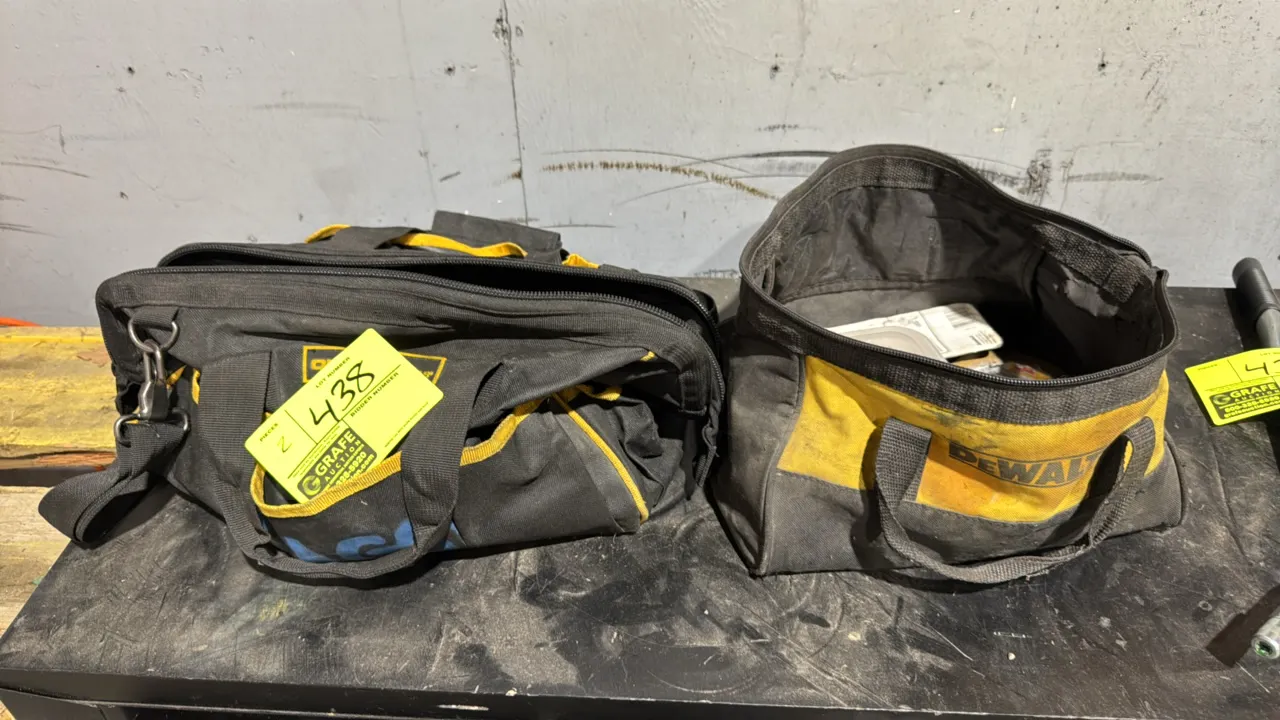Tool bags with assorted contents. Includes DeWalt canvas tool bag and zippered tool bag with shoulder strap. Contents include assorted sockets, hardwa