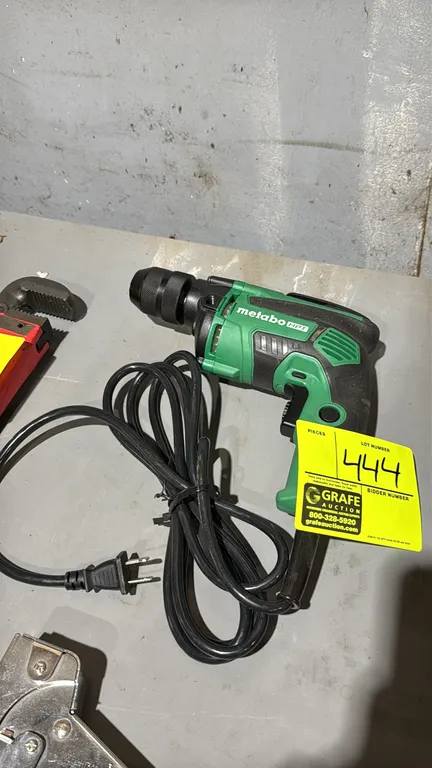 Metabo HPT D 10VH2 3/8" electric drill. Features a keyless chuck, variable speed trigger (0-2,700 RPM), forward/reverse switch, lock-on button, and in