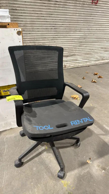 Mesh back office chair with foam kneeling pad. Features a black mesh back, upholstered seat, and fixed armrests. Includes a black foam kneeling pad wi