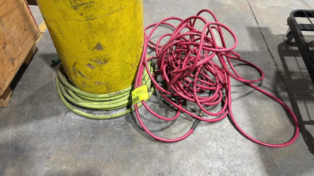 Air and water hoses. Includes a Flexzilla 5/8" ID water hose rated for 150 PSI working pressure and a red pneumatic air hose with quick-connect fittin