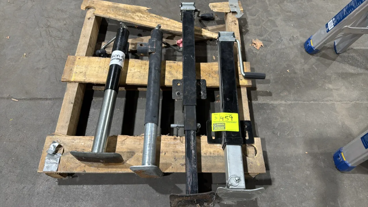 Assorted trailer jacks. Features square and round tube styles, manual crank handles, integrated mounting brackets, drop legs, and steel foot plates. N