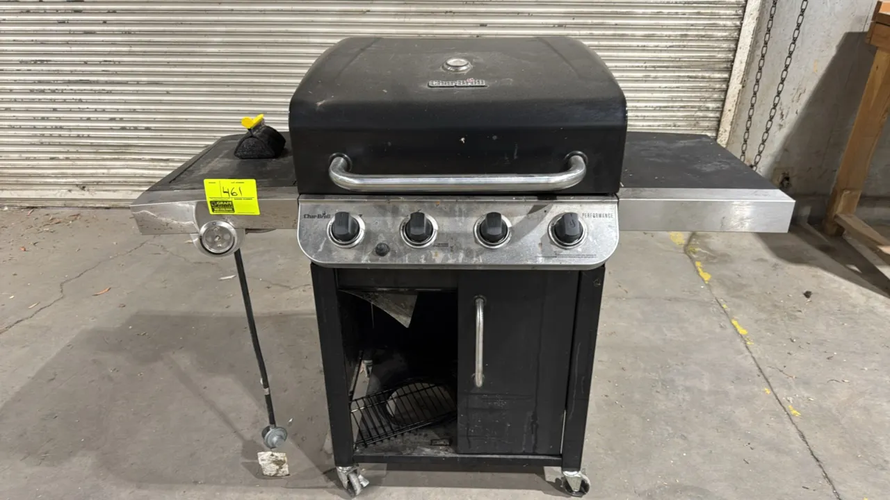 Char-Broil Performance 4-burner propane grill. Features dual side shelves, push-button ignition, and LP regulator hose. 53"W. Mounted on casters. Note