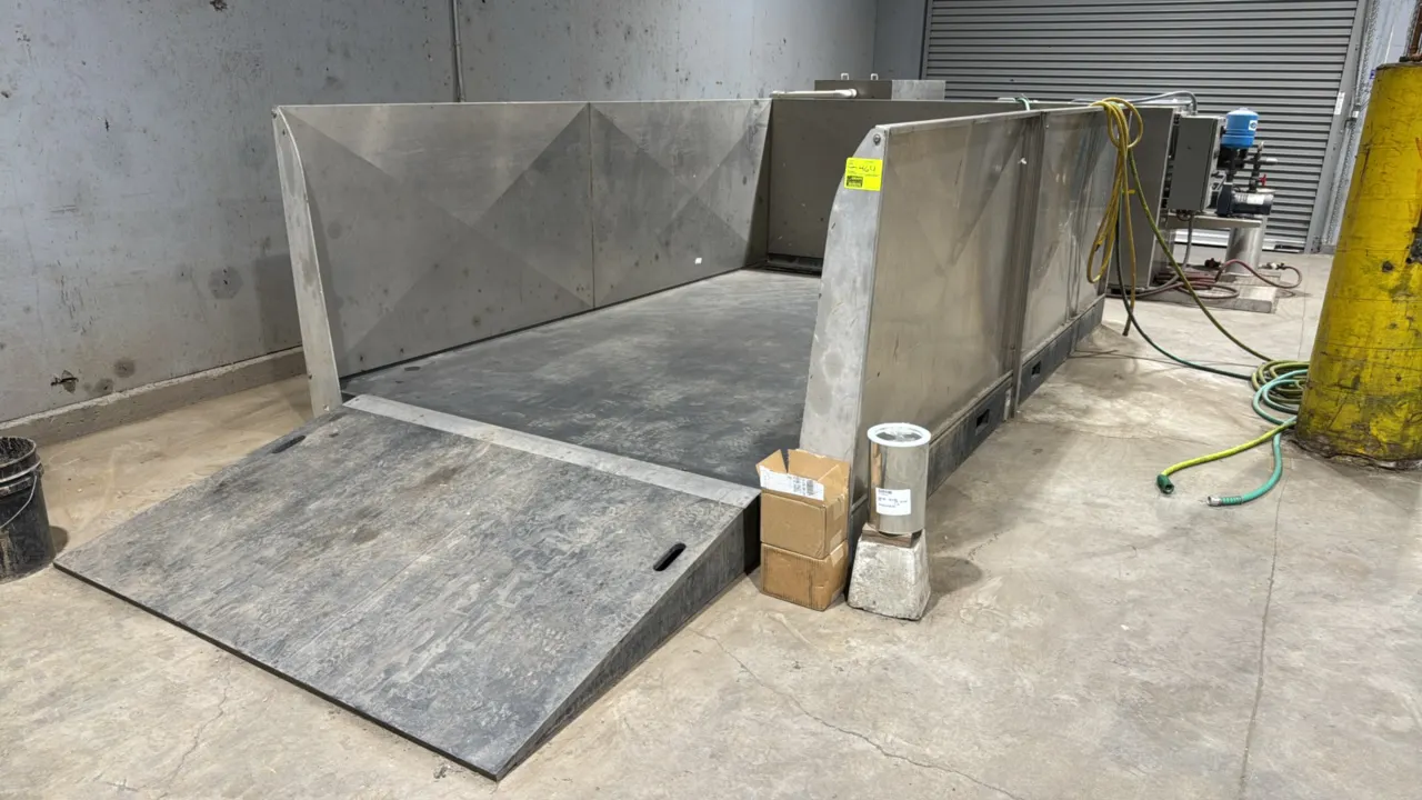ESD Waste2Water closed-loop wash water recycling system. Includes 8'x13'x4' stainless steel wash pad bin with drive-on ramp, elevated settling tank, f