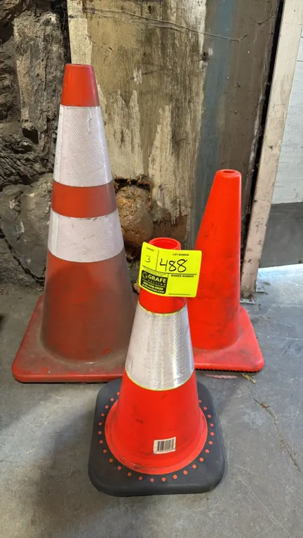Orange vinyl traffic safety cones. Features assorted heights, weighted square bases, and reflective collars on select units.