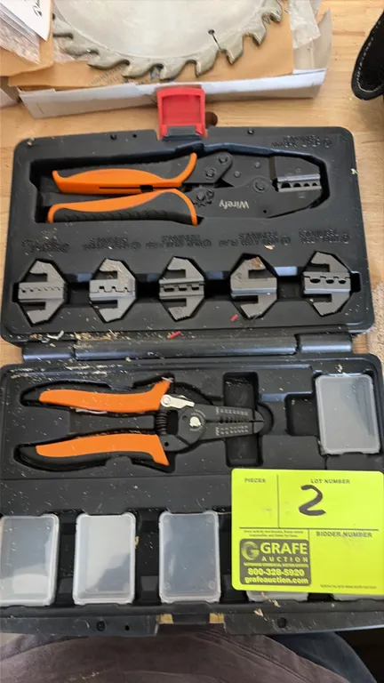 Wirefy ratcheting wire crimper and stripper tool set. Includes ratcheting crimp tool, wire stripper, interchangeable crimp dies, and hardware storage