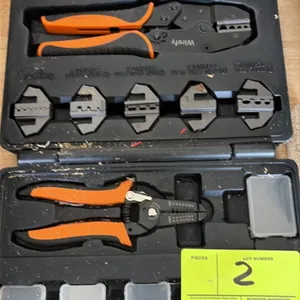 Wirefy ratcheting wire crimper and stripper tool set. Includes ratcheting crimp tool, wire stripper, interchangeable crimp dies, and hardware storage 