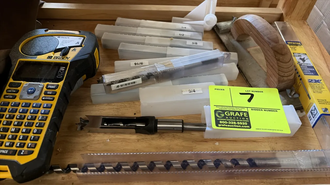 Workshop accessories package lot. Includes a Brady M210 handheld label printer, assorted mortising chisel bits in protective sleeves, Irwin auger and
