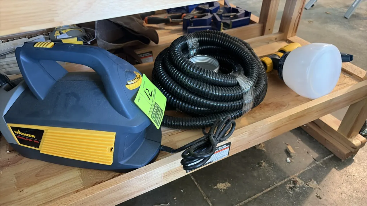 Wagner Control Spray Max HVLP paint sprayer system. Includes turbine base unit, flexible air hose, spray gun with material cup, and additional metal c