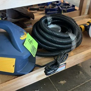 Wagner Control Spray Max HVLP paint sprayer system. Includes turbine base unit, flexible air hose, spray gun with material cup, and additional metal c