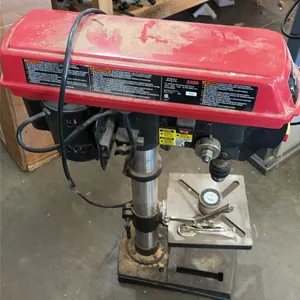 Skil 3320 10" benchtop drill press. Features an adjustable slotted work table, 3-spoke downfeed handle, and safety power switch. Speed range: 570-3,05
