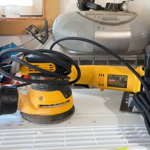 DeWalt woodworking power tool lot. Includes a DeWalt DWE6421 random orbit palm sander with attached dust bag and a DeWalt DW682 plate joiner. Electric
