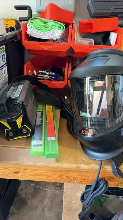 Assorted workbench tools and welding accessories lot. Includes RoMech RM-009 200W electric hot knife kit with case, Guozhi mini arc welder, Kuject wel