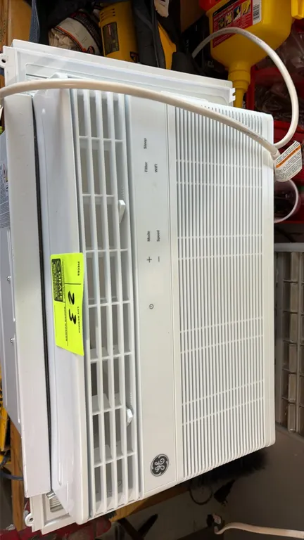 GE AWCS08WWF1 window air conditioner. Features digital controls, integrated Wi-Fi connectivity, directional air louvers, and expandable side accordion