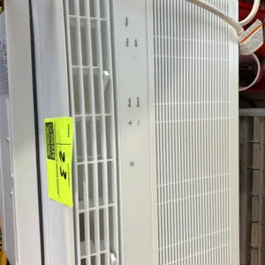 GE AWCS08WWF1 window air conditioner. Features digital controls, integrated Wi-Fi connectivity, directional air louvers, and expandable side accordion