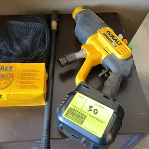 DeWalt DCPW550 20V cordless power cleaner. Features onboard nozzle storage and quick-connect water inlet. Includes spray wand, spray nozzles, mesh sto