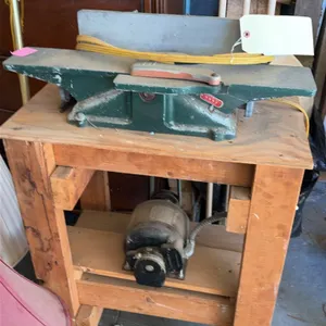 Shopmaster 6" jointer. Features cast iron construction, adjustable fence, and spring-loaded blade guard. Includes electric motor and drive belt. Mount