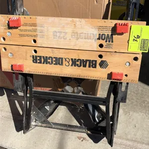 Black & Decker Workmate 225 portable project center and vise table. Features dual clamping cranks, wooden vise jaws with printed measurement markings,