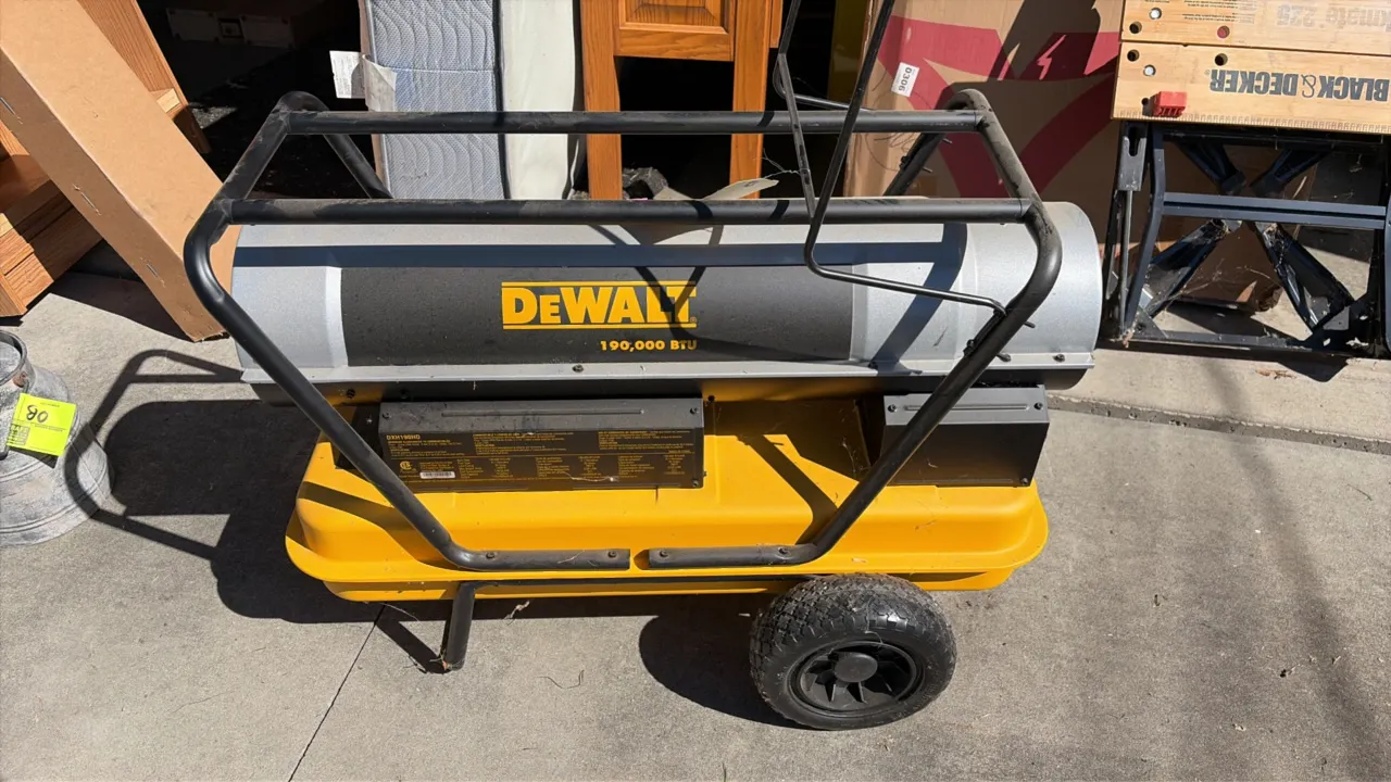 DeWalt DXH190HD forced air torpedo heater. Features 190,000 BTU heat output, adjustable thermostat control, integrated fuel tank, and tubular roll cag