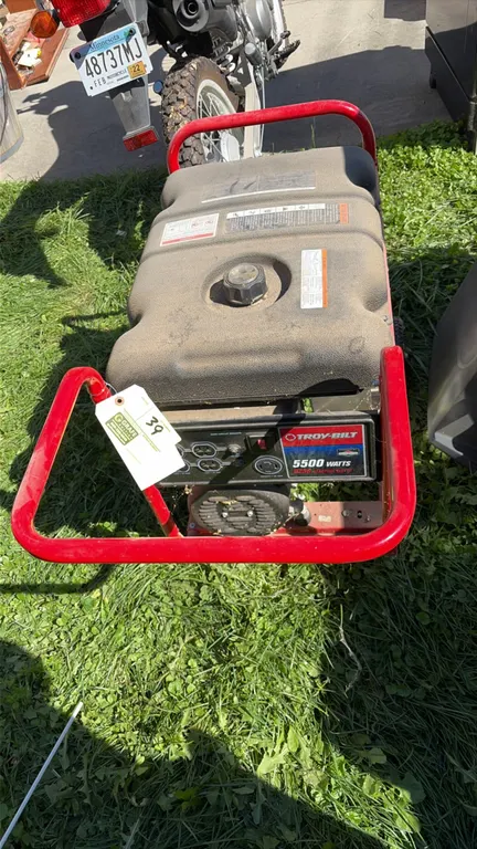 Troy-Bilt portable gas generator. Powered by a Briggs & Stratton engine. Features 5,500 running watts, 8,250 starting watts, (4) 120V 20A outlets, and