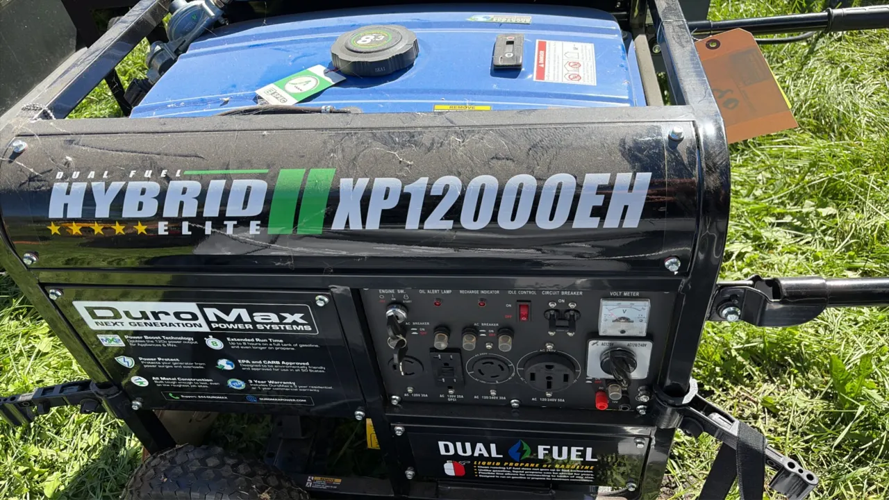 DuroMax XP12000EH dual-fuel portable generator. Features electric start with key switch, dual-fuel operation for gasoline or liquid propane, analog vo