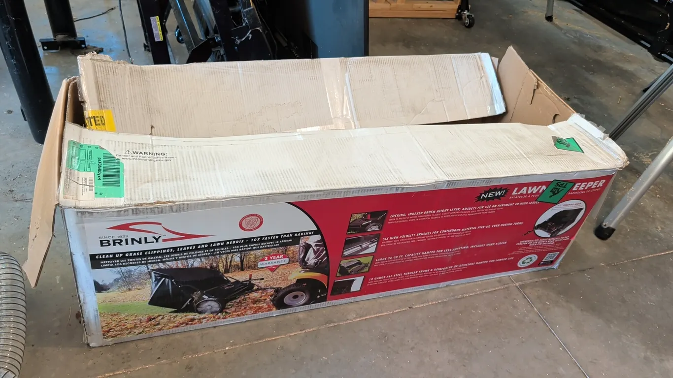 Brinly tow-behind lawn sweeper. Features a 20 cu. ft. capacity hamper, (6) high-velocity brushes, locking indexed brush height adjustment, and swing h