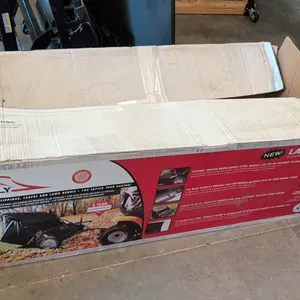 Brinly tow-behind lawn sweeper. Features 20 cu. ft. capacity hamper, six high-velocity brushes, locking indexed brush height adjustment, and swing ham