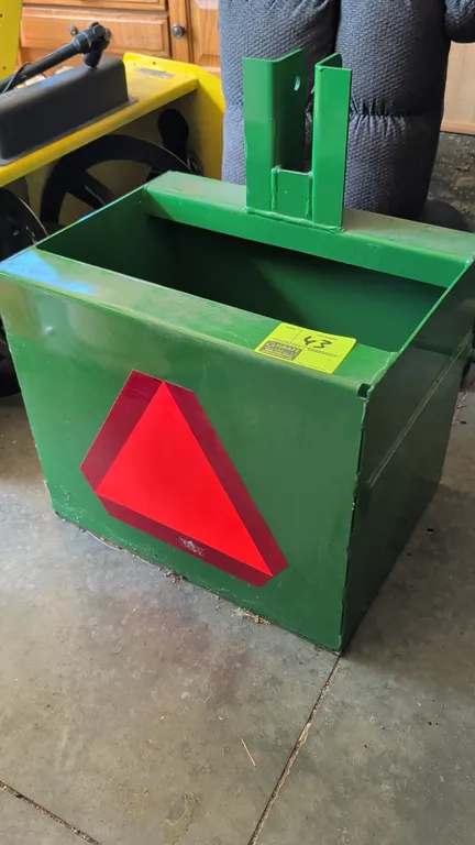 John Deere 3-point rock box. Features iMatch compatibility, rear reflective emblem, and lower hitch pins. 24"W.