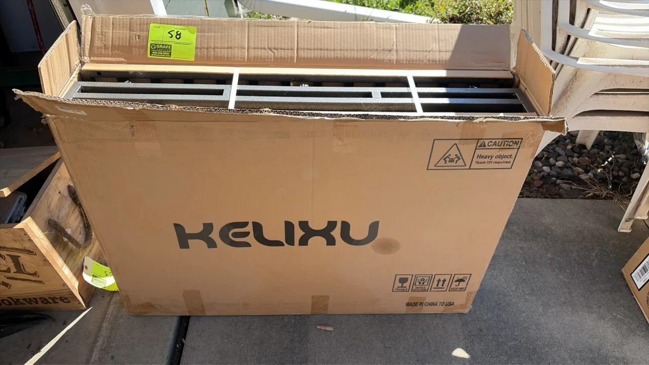 Kelixu 48" dog crate. Features steel construction with hammer-tone finish. Unassembled in open packaging.