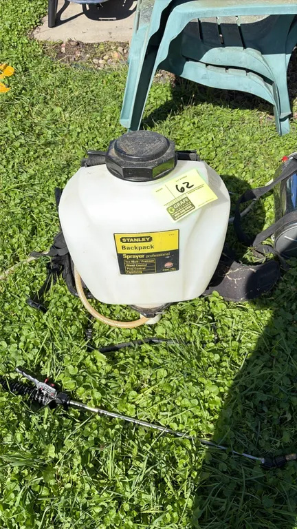 Stanley 61814 4-gallon professional backpack sprayer. Features a translucent poly tank, padded adjustable shoulder straps, chemical-resistant hose, an