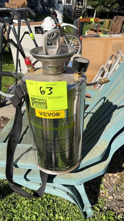 Vevor stainless steel auto-pressure sprayer. Features a stainless steel tank, manual pump handle, top-mounted pressure gauge, pressure relief valve, a