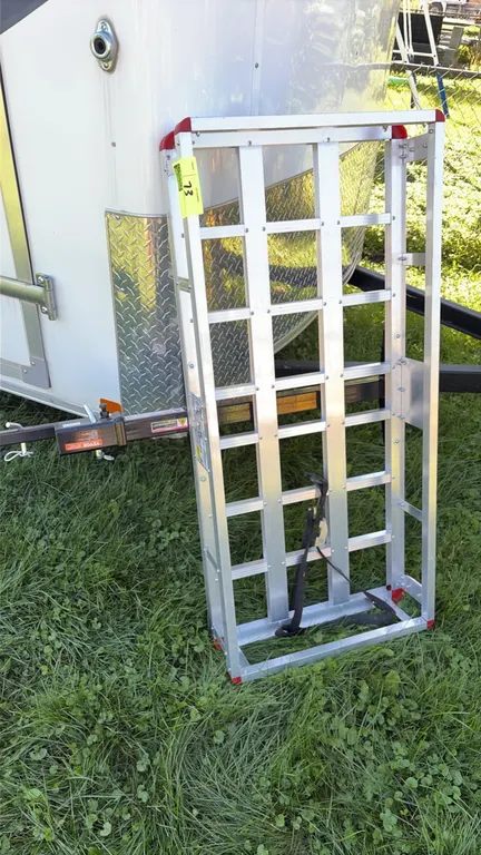 MaxxHaul 70107 aluminum hitch cargo carrier. Features 500 lb distributed capacity, red corner reflectors, and lightweight aluminum construction. Fits