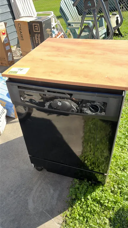 GE GSC3500N10BB portable dishwasher. Features wood-look laminate top, black front panel, pull-out wire dish racks, silverware basket, and faucet conne