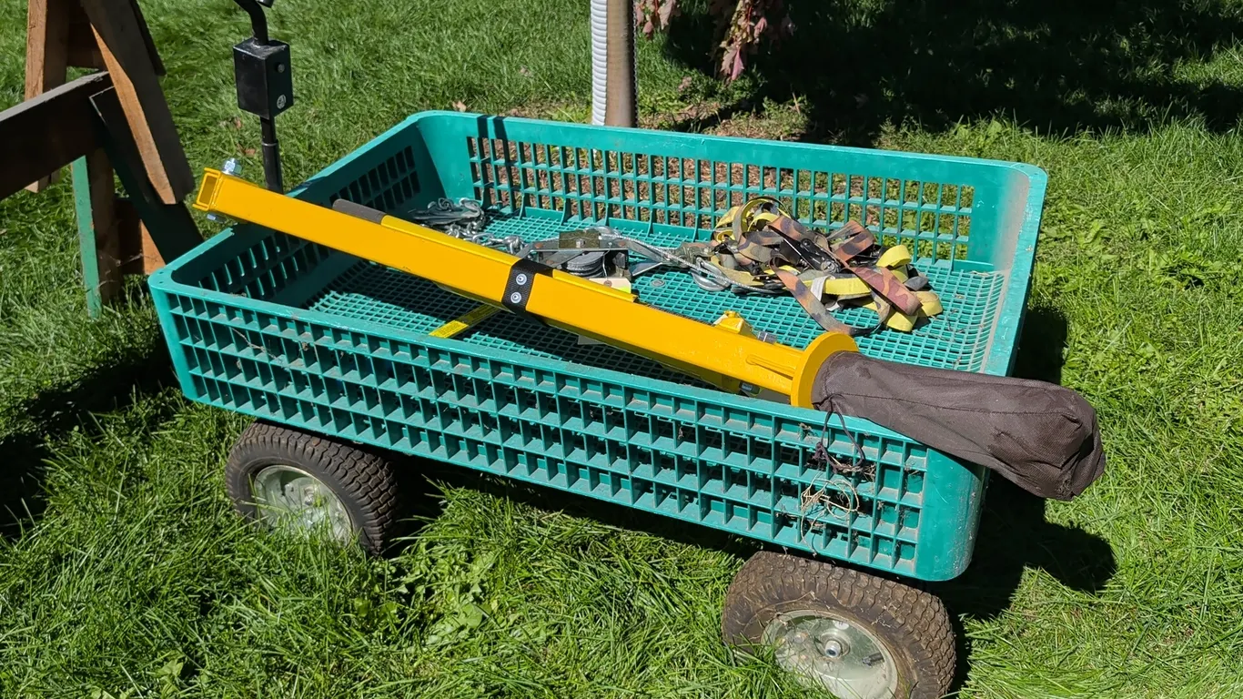 Plastic yard cart. Features a green molded plastic grid bed and pull handle. Dimensions: 46" x 30". Mounted on (4) pneumatic tires. Contents not inclu