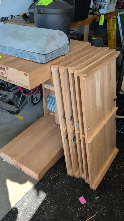 Wooden expandable dining table. Features telescoping metal slides, center support leg, and includes (5) extension leaves. Items on top not included.