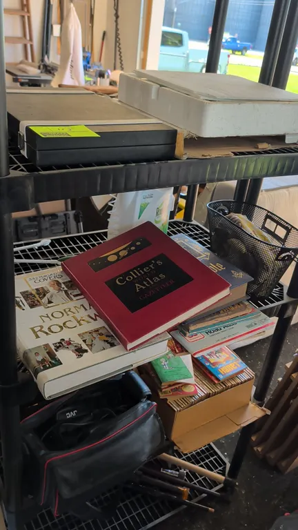 Assorted household and media lot. Includes GSE backgammon set in folding briefcase, Howard Miller pendulum wall clock, JVC camcorder in soft carry cas