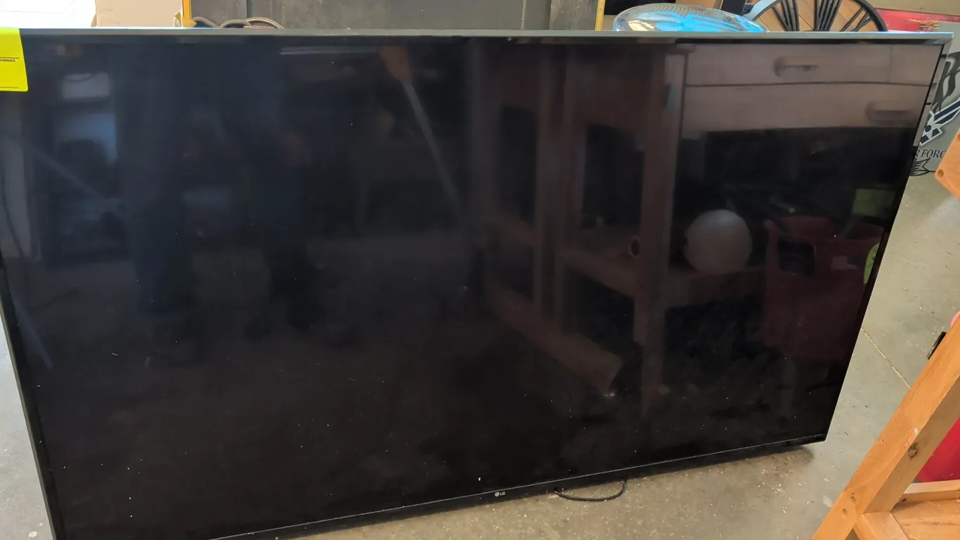 2019 LG 65UM6900PUA 65" television. Features attached rear articulated wall mount bracket. S/N: 911RMPGC0728. Electrical: 120V, 50/60 Hz, 185W. Note:
