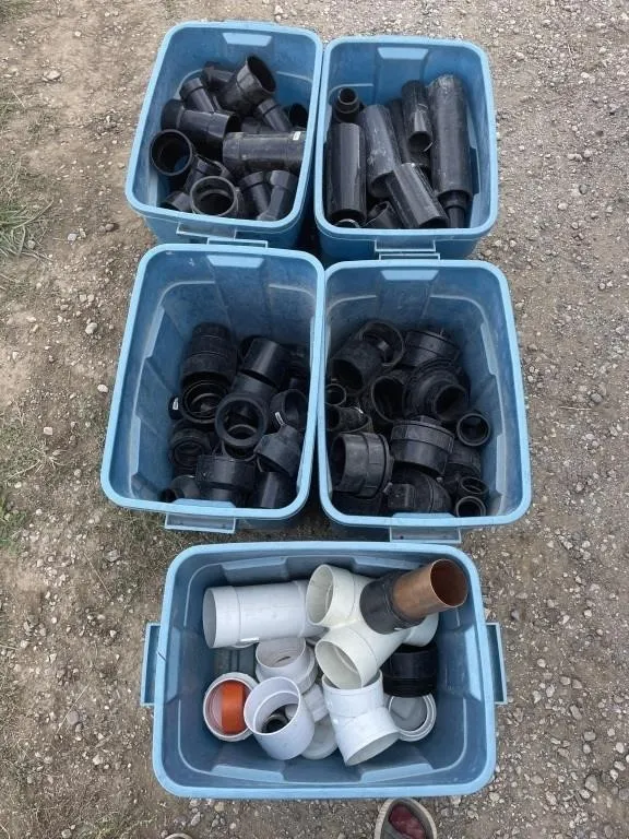 Various Black Plumbing Pipe In 5 Blue Bins