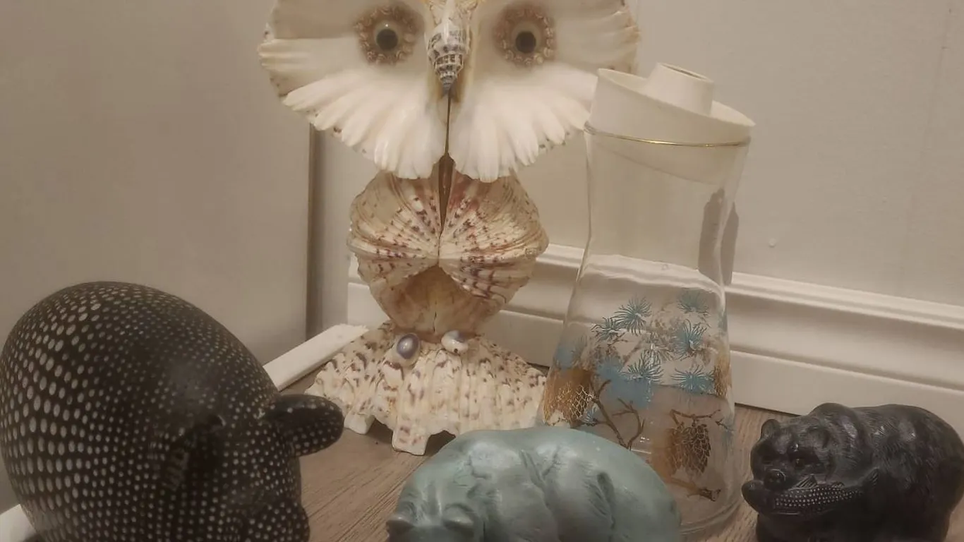 4 Animal Figurines and 1 Glass Carafe with Pinecone Design