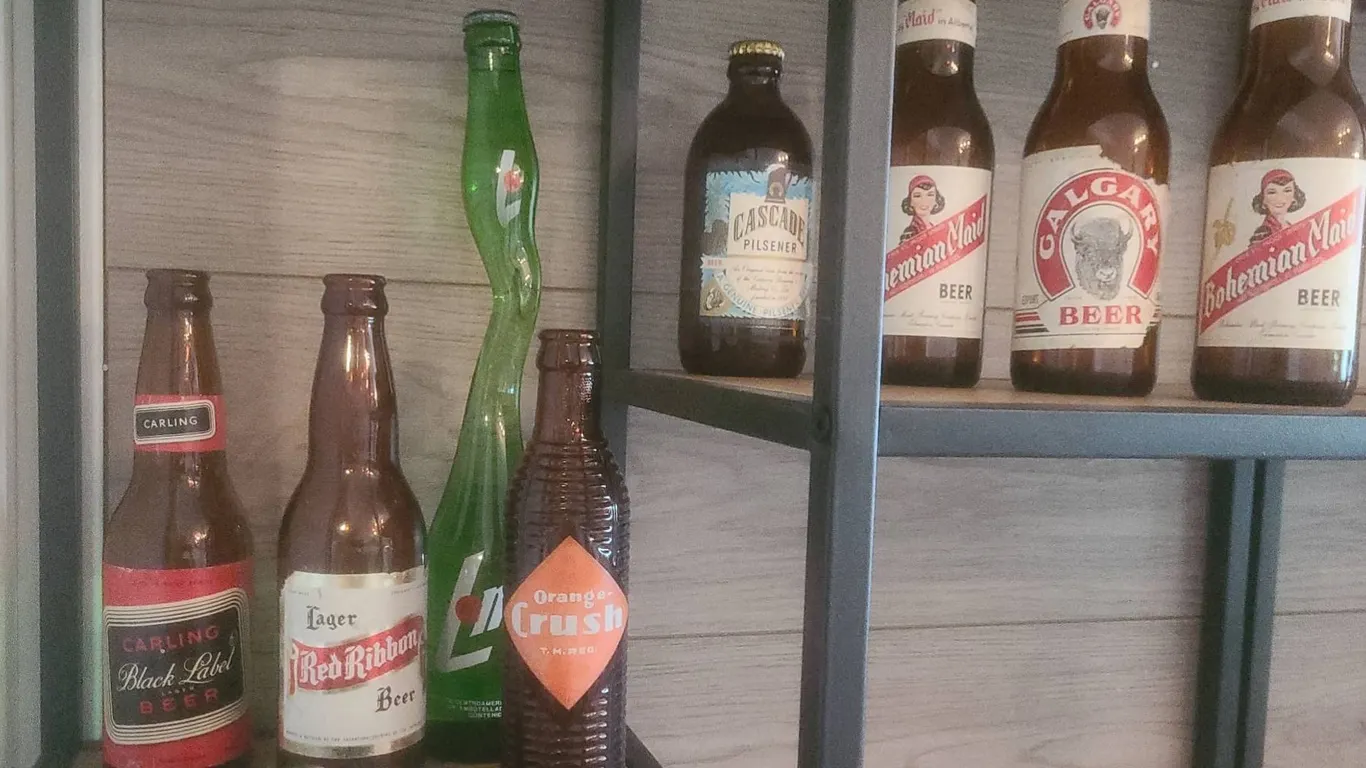 Vintage Beer and Soda Bottles, Cast Iron Doorstop