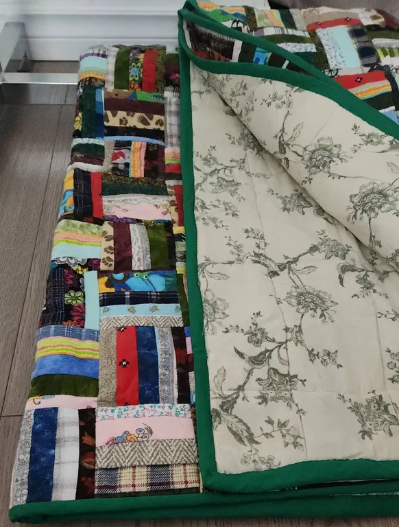 Colourful Patchwork Quilt with Green Border and Floral Reverse Backing