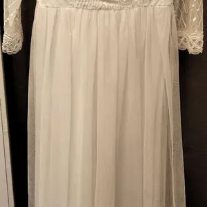 White Bridal Gown with Lace Overlay and Bead Accents