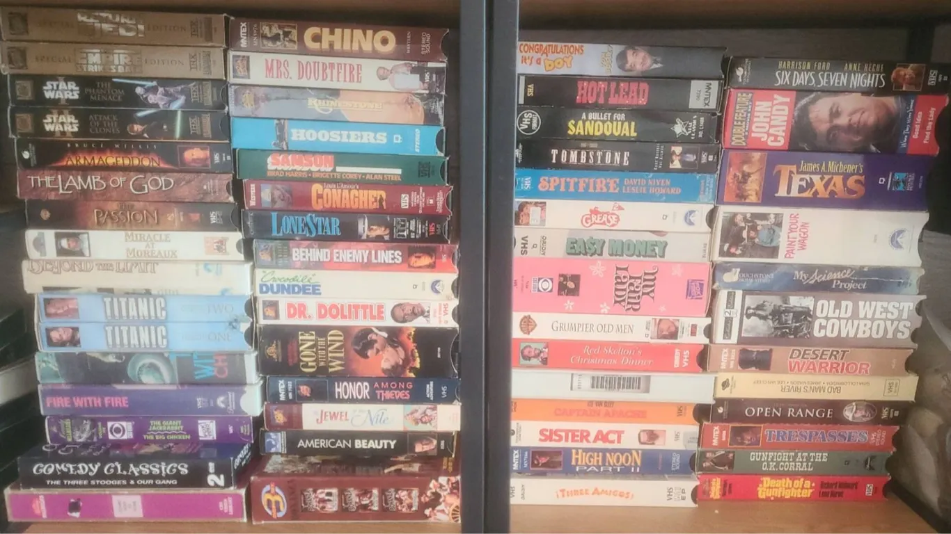 Selection of VHS Tapes Featuring Classic Films and TV Shows