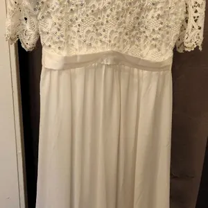 White Lace Bridal Gown with Beaded Embellishments