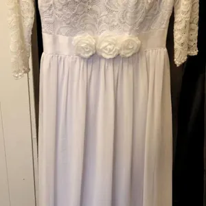White Lace Bridal Gown with Pearl Trim and Floral Waist Detail