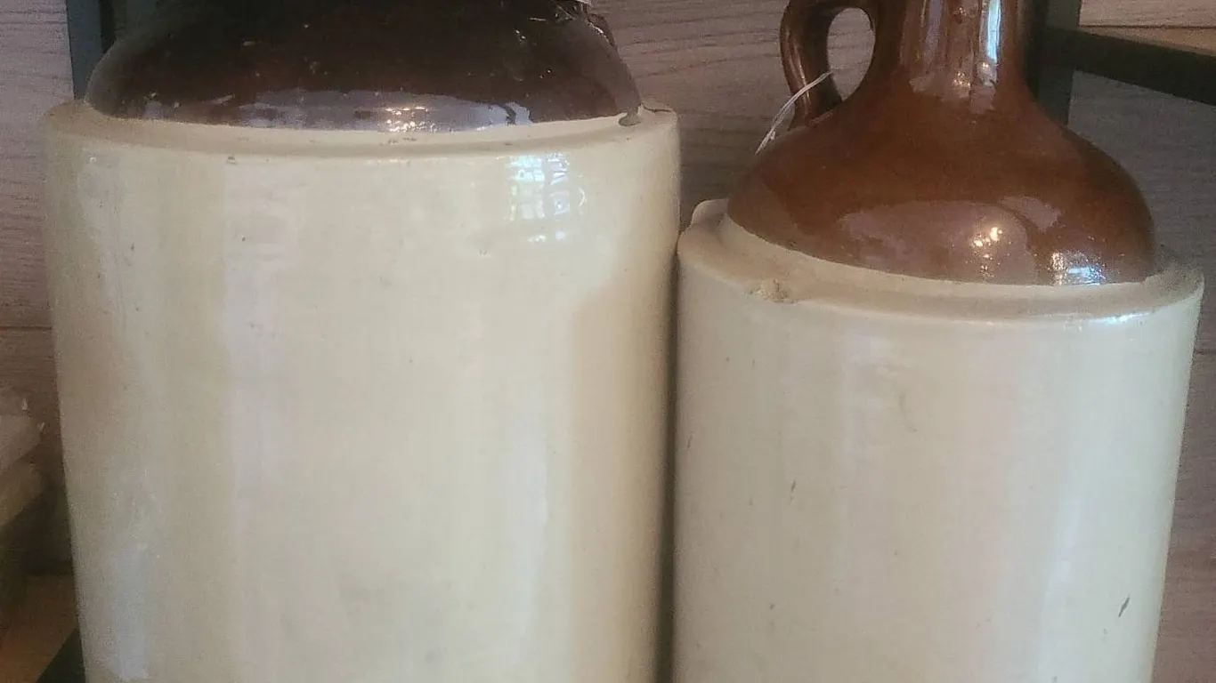 2 Brown-Top Stoneware Jugs