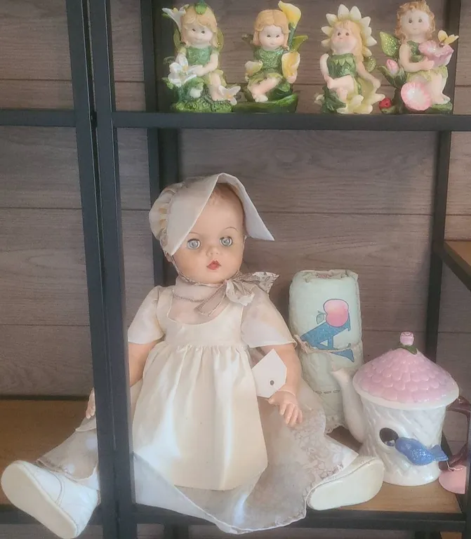 Baby Doll, Ceramic Teapot, Alphabet Quilt, and Four Fairy Figurines